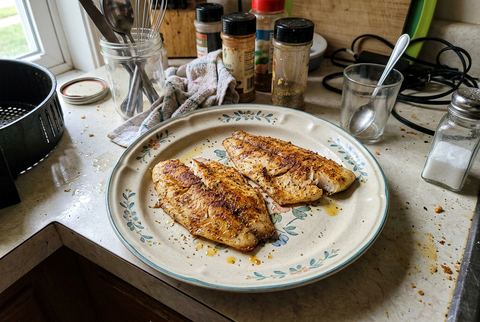 Flaky air fryer tilapia fillets with a golden seasoned crust