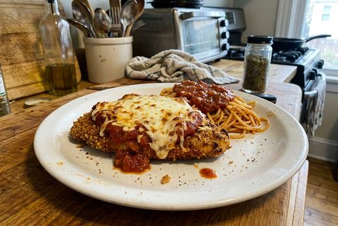 Baked chicken parmesan with crispy breading, marinara, and melted mozzarella